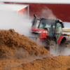 The MF8727, pushing mulch.