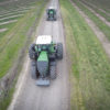Two Tractors rumble down the path on Jered Rediger's farm.